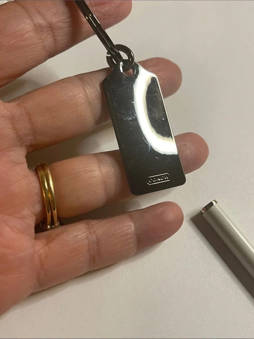 Coach Gunmetal Key Tag With White Coach Pen